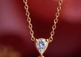 Gold necklace with heart-shaped diamond pendant