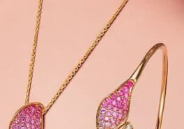 Gold bangle with leaf design and diamonds